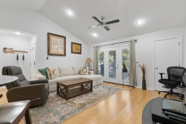 Living room featuring ceiling fan, vaulted ceiling, light wood-style flooring, and recessed lighting | Image 6