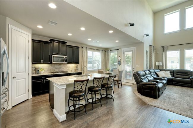 oversized center island, walk in pantry, lots of storage | Image 11