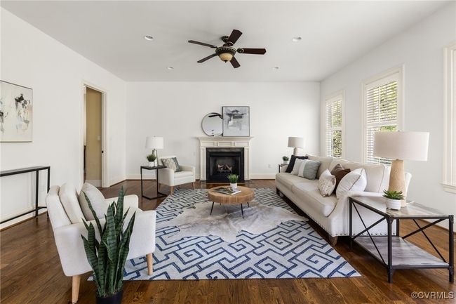 10'Ceilings, 8' door, Gas fireplace, Site finished hardwood floors, Ceiling fan with light fixture, Recessed lighting, Floor outlet, Access to rear patio, Surround sound | Image 15