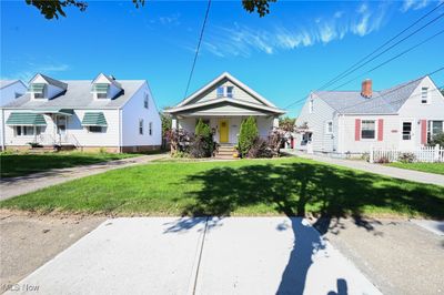 Bungalow-style house featuring a front yard | Image 1