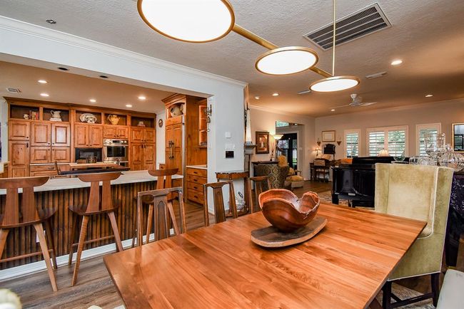 View from the dining room, showing the open flow to the living room and to the Chef's Dream Kitchen. | Image 13