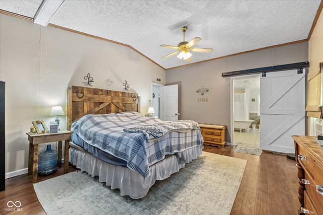 One of TWO primary bedroom suites. This one has a large walk in closet. This primary bath features double sinks and a restored clawfoot tub/shower. | Image 20