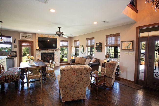Living room with plenty of natural light, a ceiling fan, wood-type flooring, and recessed lighting | Image 20