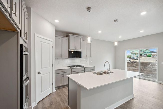 Large eating area off the kitchen is perfect for meals at any time of the day. Photos used are from a model of a similar plan/home representation. Some colors and options will vary. | Image 5