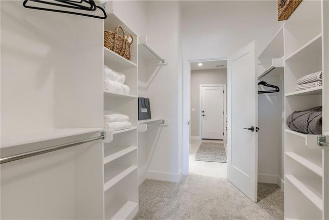 Spacious closet with carpet floors | Image 18