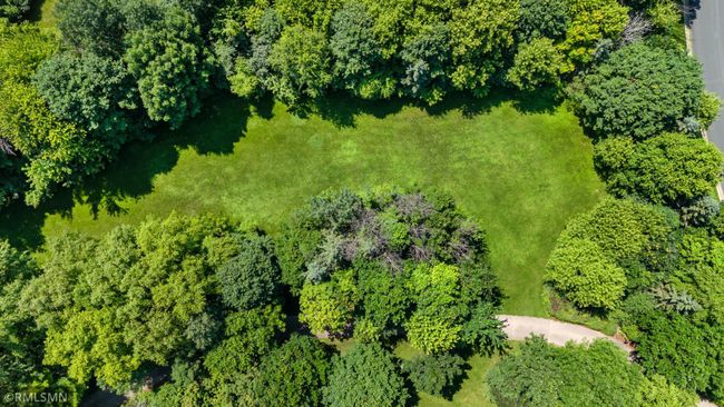 Ariel shot of lawn and street with driveway in the foreground. | Image 93