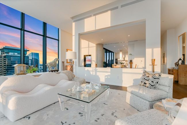 The open-concept layout seamlessly connects the living room to the kitchen and dining area, ideal for effortless entertaining. | Image 6