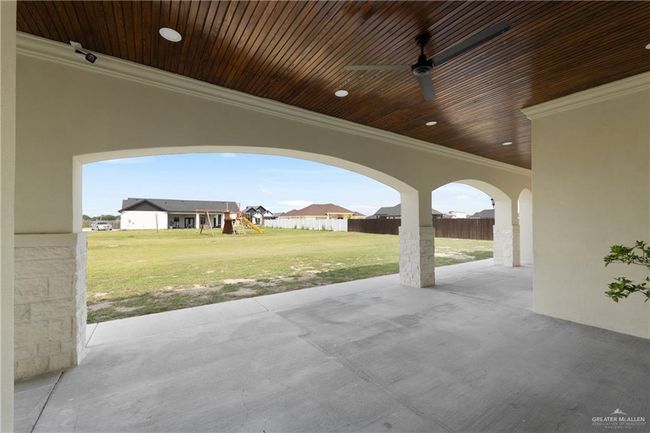 Enjoy seamless indoor-outdoor flow through oversized sliding glass doors, perfect for entertaining. | Image 37