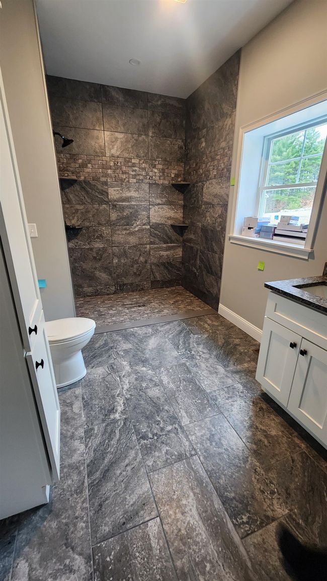 Upgraded tile shower and floor | Image 24