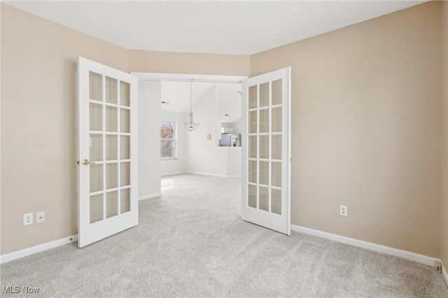 Spare room or office, featuring NEW carpet flooring, and french doors | Image 14