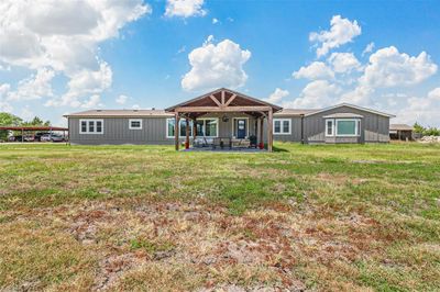 Front with a covered patio area, and a lawn | Image 2