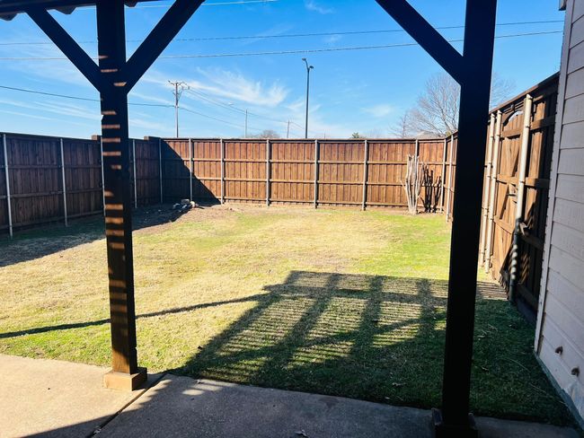 View of yard with a fenced backyard | Image 23