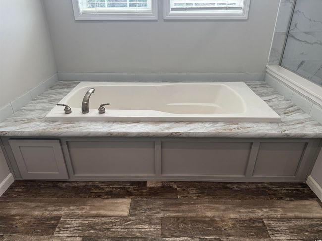 Full bathroom featuring a bath | Image 19