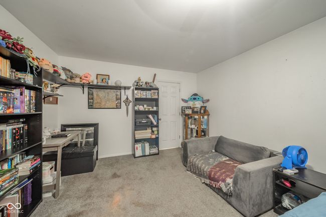 living area with carpet | Image 18