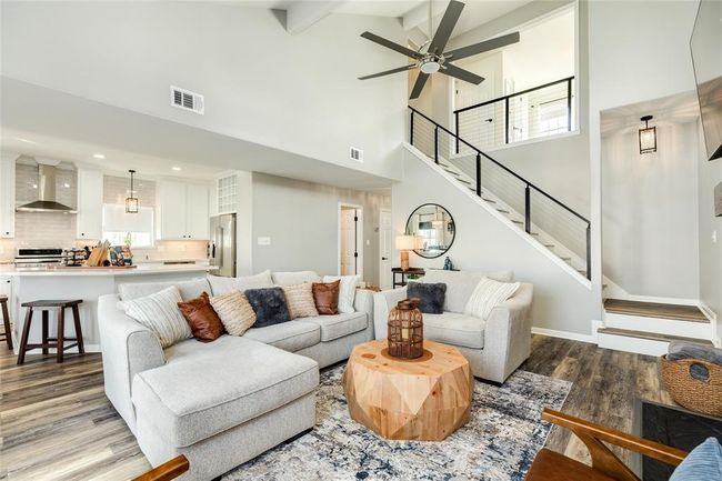 Stair rail and bannisters replaced with sleek metal and cable | Image 11