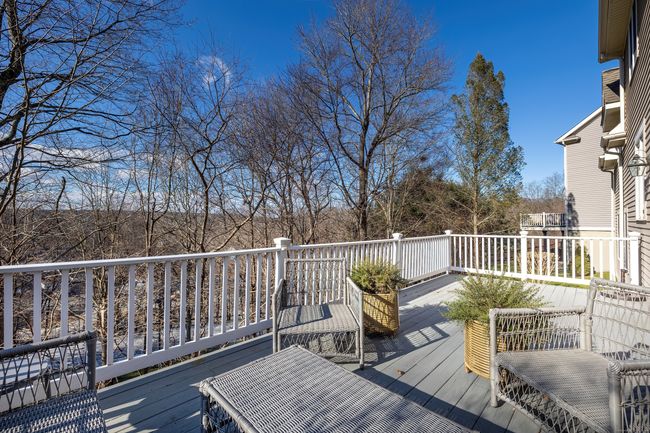 Full deck with lots of space, views of the valley, and surrounded by mature trees | Image 26