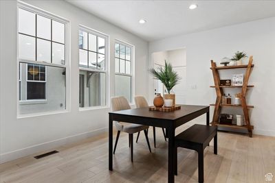 Dining area with light wood-type flooring | Image 3