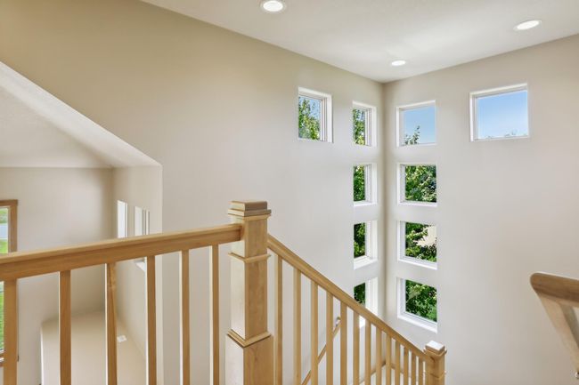 Windows galore! Stunning, modern accents! Stylish window designs bring nature inside making this entire home light, bright and cozy! So warm and welcoming! Gorgeous, natural woodwork throughout! | Image 50