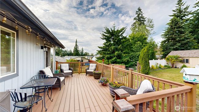 Comfortable outdoor deck space perfect for relaxing or entertaining | Image 5