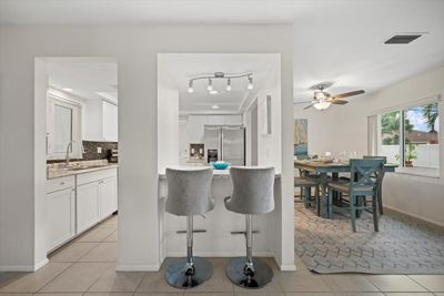 Breakfast Bar Leading to Kitchen/Dining Room | Image 2