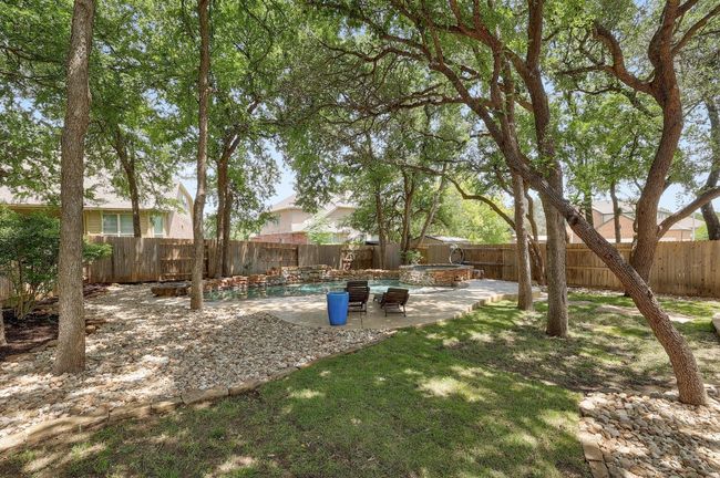 With its pristine waters and serene ambiance, the pool transforms the backyard into your own personal retreat, offering a refreshing escape right at home | Image 37