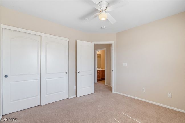 Unfurnished bedroom featuring light carpet, a closet, and ceiling fan | Image 8