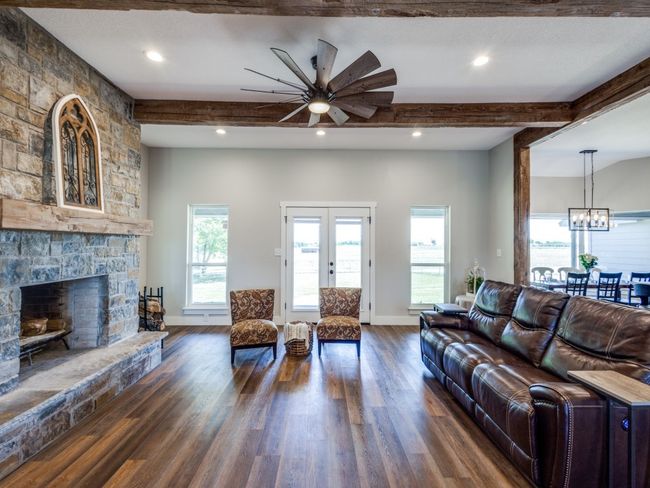 This photo gives you a close up view of the massive stone fireplace. | Image 8