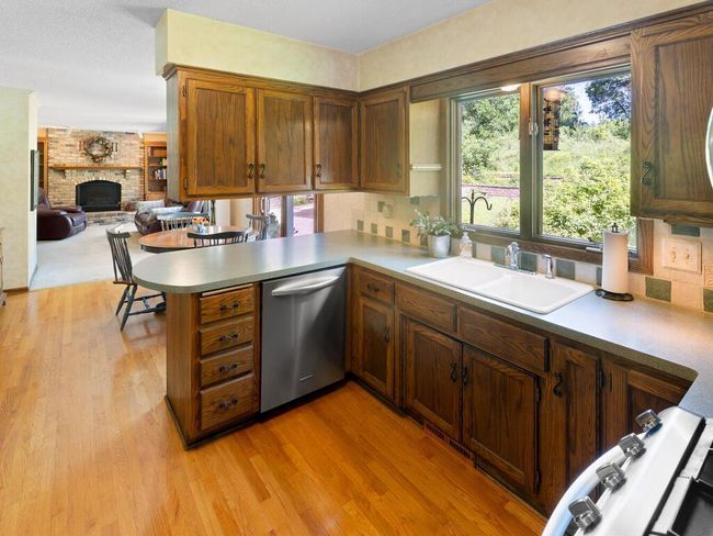 Hardwood floors throughout Kitchen and Informal Dining | Image 15