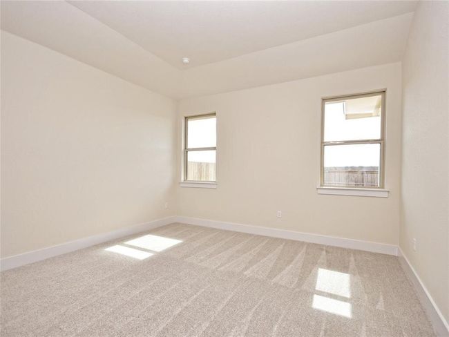 Empty room with light colored carpet and baseboards | Image 12