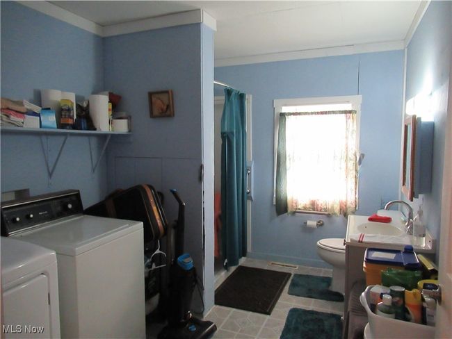 Full Bath with Shower / Laundry area Washer and Dryer stay with the home | Image 17
