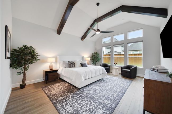 The spacious primary retreat has large windows that bring an abundant of natural light. | Image 23