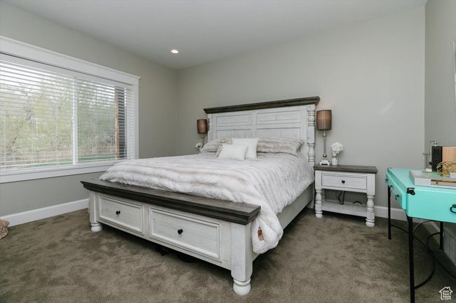 Bedroom with recessed lighting, dark colored carpet, and baseboards | Image 40