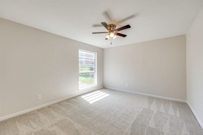 Carpeted spare room featuring ceiling fan | Image 14