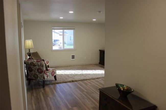 Sitting room with recessed lighting and wood finished floors | Image 21