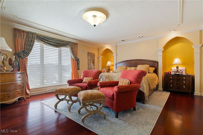 This is a partial view of the Primary bedroom. This primary bedroom has hardwood flooring, stunning ceilings and very spacious. | Image 24