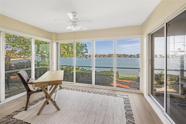Screened lanai enclosed with impact glass sliders | Image 38