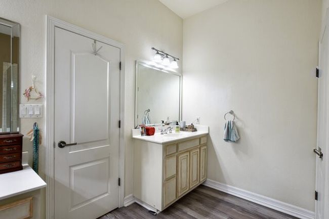 Bathroom with vanity and wood finished floors | Image 21
