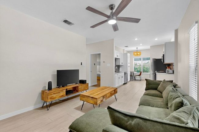 Living area featuring ceiling fan, light wood-type flooring, and recessed lighting | Image 12