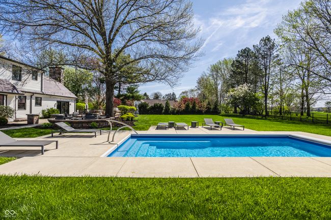 outdoor pool with fence, a yard, and a patio area | Image 66