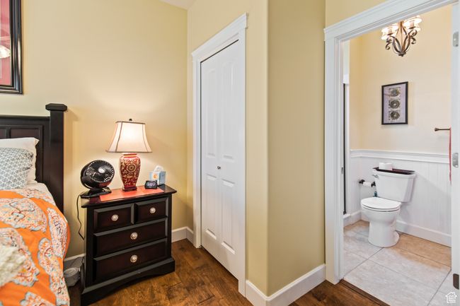 Bedroom featuring a closet and dark hardwood / wood-style flooring | Image 56