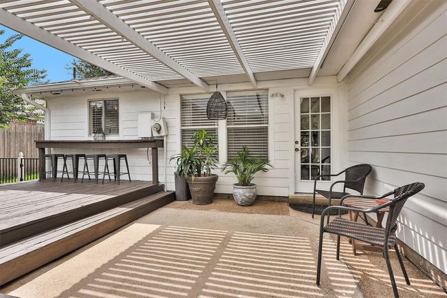 Step outside to an oversized deck with bar seating and spacious patio—perfect for entertaining, outdoor dining, or simply unwinding in your private backyard retreat. | Image 29