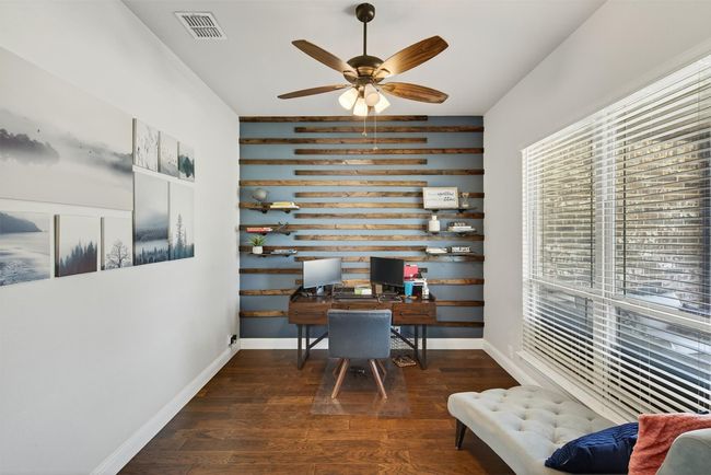 Office area with a ceiling fan and wood finished floors | Image 8