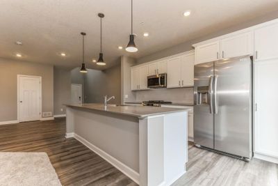 (Photo of an inventory home, actual homes finishes will vary) There is so much space in the kitchen! | Image 3