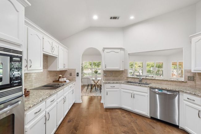 Beautifully updated kitchen with SS appliances. | Image 4