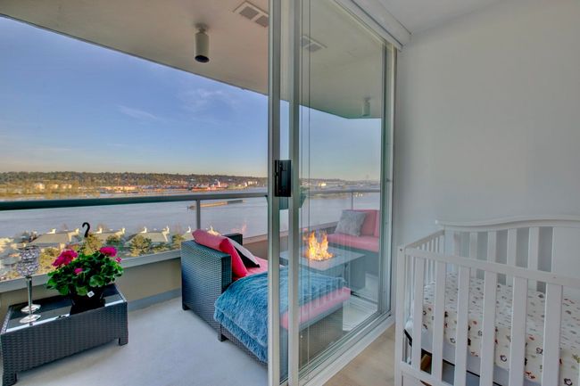 Bedroom featuring a water view | Image 19
