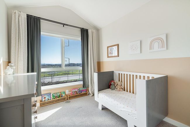 Bedroom featuring lofted ceiling and carpet | Image 21