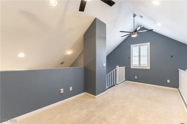 Additional living space with baseboards, carpet flooring, ceiling fan, and lofted ceiling | Image 31