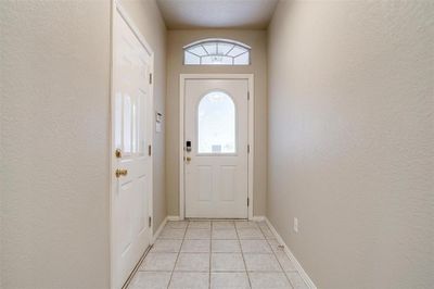 Doorway to outside with light tile patterned flooring | Image 3