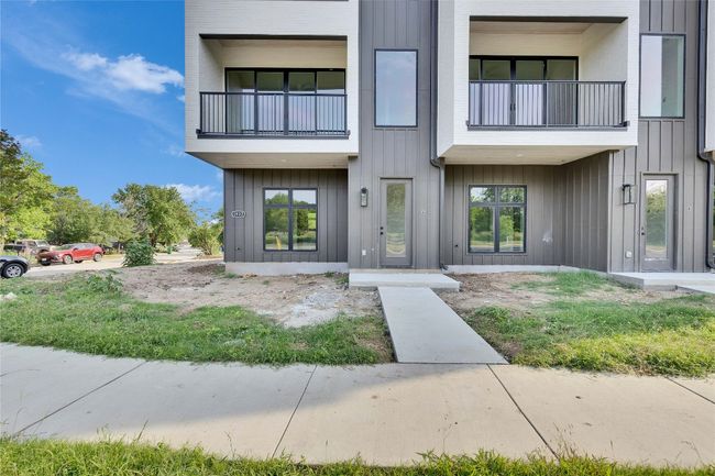 View of front of property featuring a balcony and board and batten siding | Image 10
