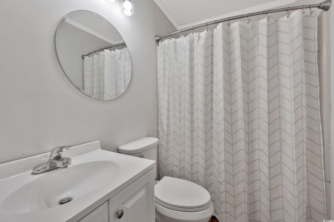 Unfurnished room with light hardwood / wood-style floors, ornamental molding, and a textured ceiling | Image 12